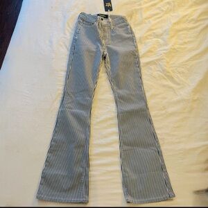 Indigo Rein sin women’s striped navy/white mid rise flare leg jeans | NWT